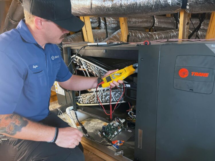 Legacy Home Services HVAC Tech with Trane unit